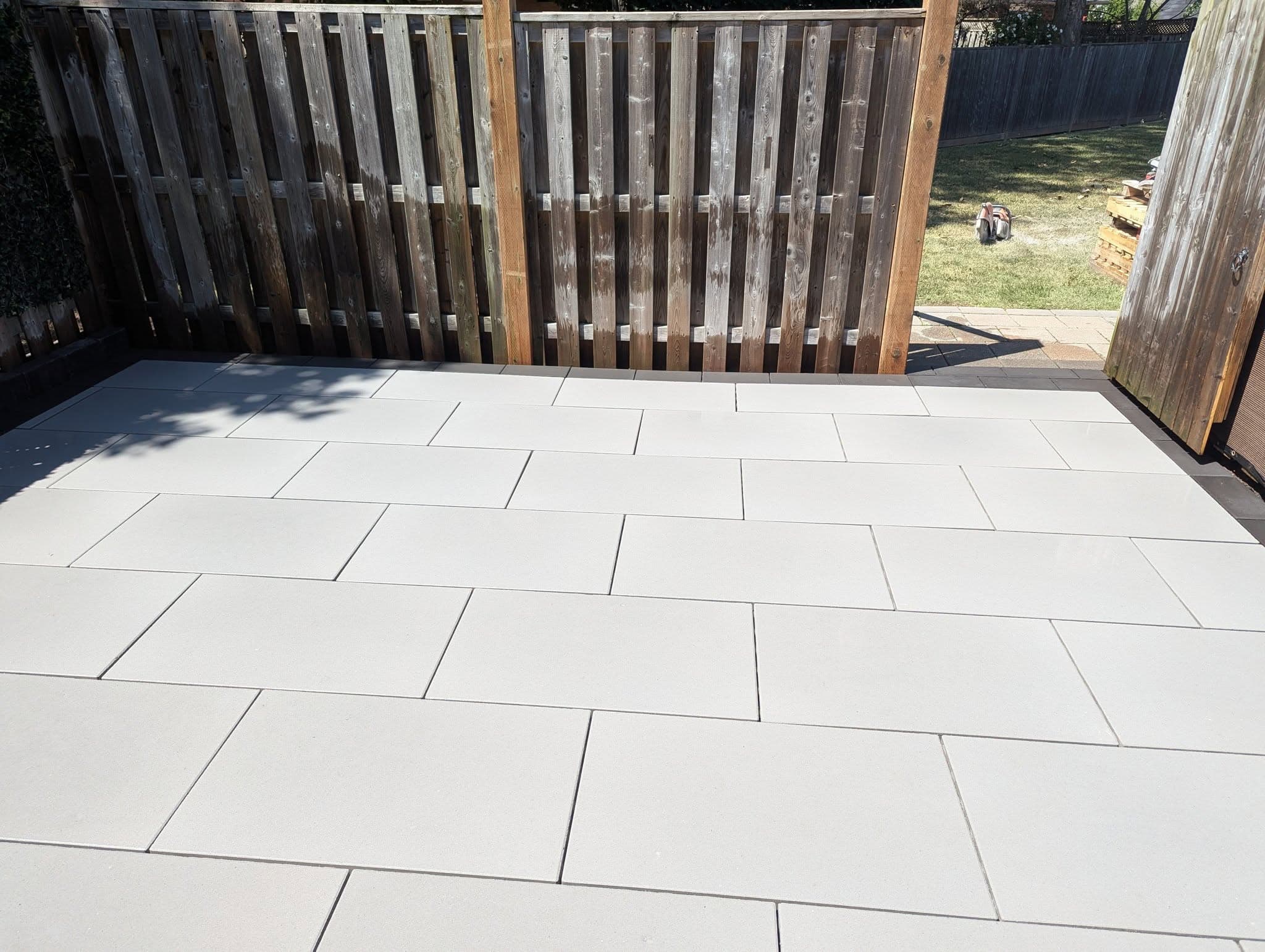 Finished large-format paver patio installed by Welbanks